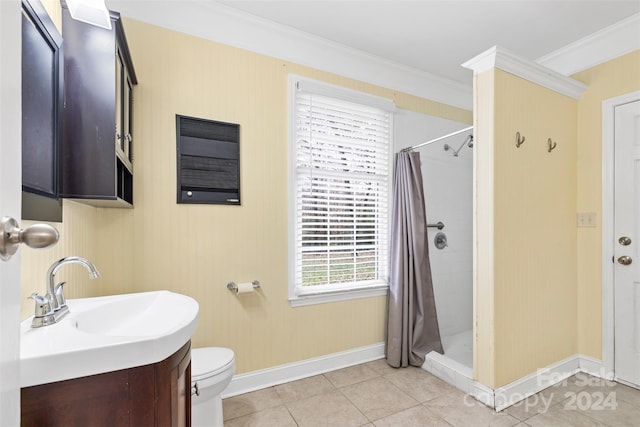 bathroom featuring vanity, tile patterned flooring, toilet, ornamental molding, and walk in shower