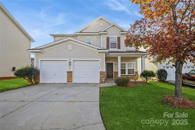 view of front of property featuring a porch, a garage, and a front lawn