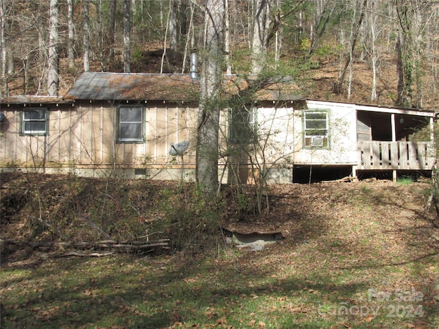 view of side of property with a deck