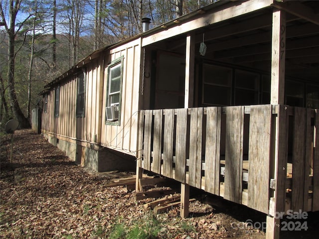 view of side of property with cooling unit