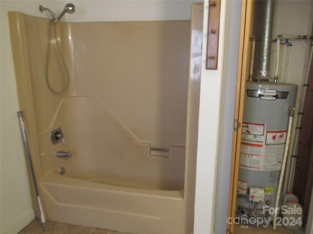 bathroom featuring water heater and shower / bathing tub combination