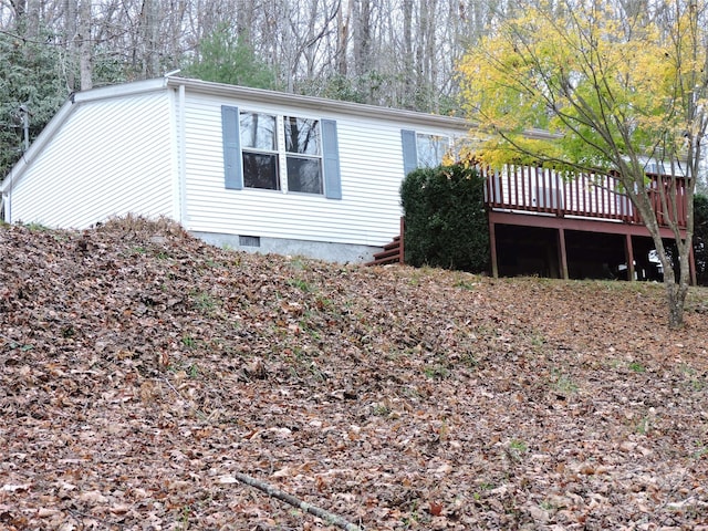 view of home's exterior featuring a deck