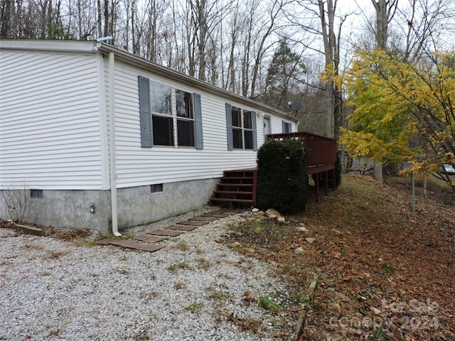 view of home's exterior featuring a deck