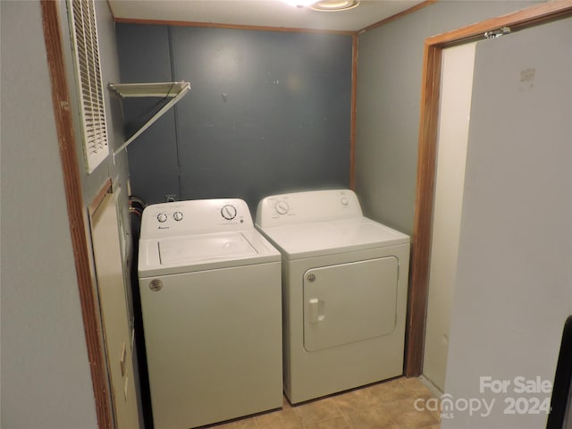 2271 Gouges Creek Rd, Spruce Pine, NC 28777 - laundry area with independent washer and dryer and light tile patterned floors