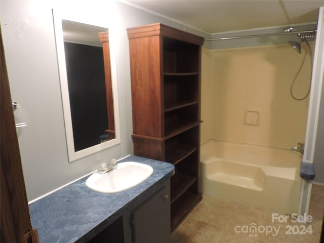 bathroom featuring tile patterned floors, vanity, and tub / shower combination