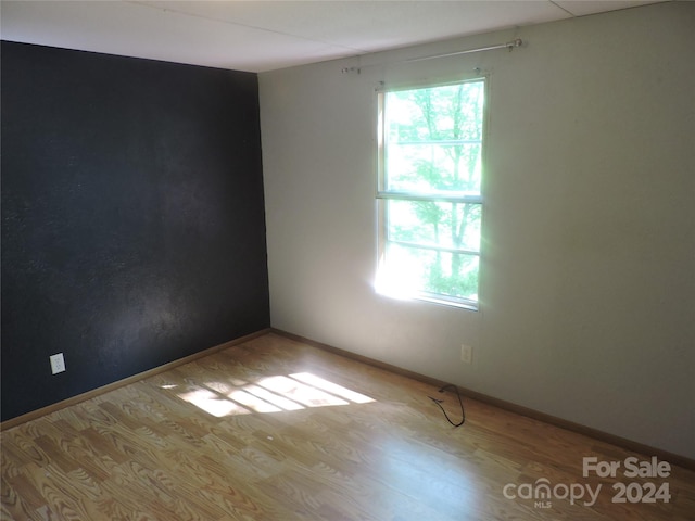 unfurnished room featuring light hardwood / wood-style flooring