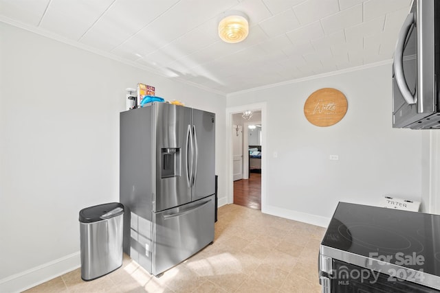 kitchen featuring crown molding and appliances with stainless steel finishes