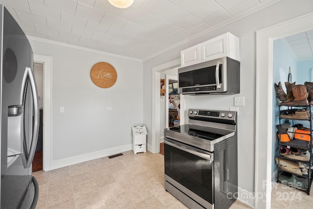 kitchen featuring white cabinets, crown molding, and appliances with stainless steel finishes