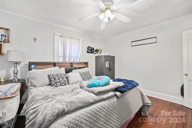 bedroom with ceiling fan, dark hardwood / wood-style flooring, and ornamental molding