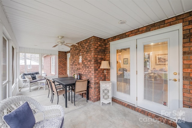 sunroom / solarium featuring ceiling fan