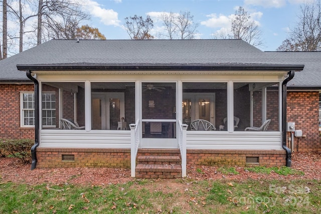 back of house with a sunroom