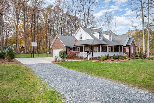 cape cod-style house featuring a front yard, a porch, and a garage