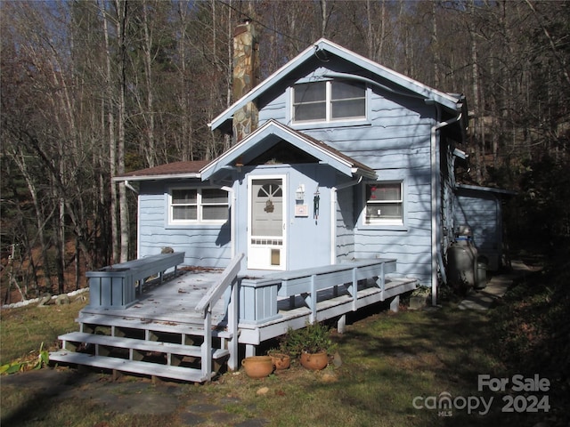 bungalow-style house featuring a deck