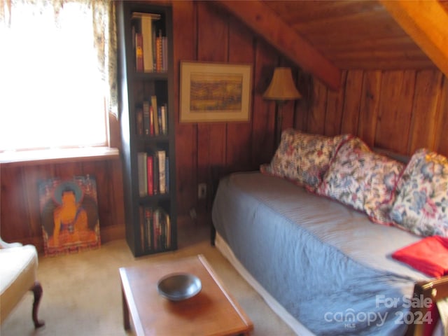 bedroom featuring wooden ceiling, vaulted ceiling, and wooden walls