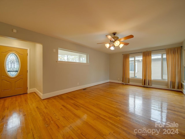 entrance foyer with light hardwood / wood-style flooring and ceiling fan