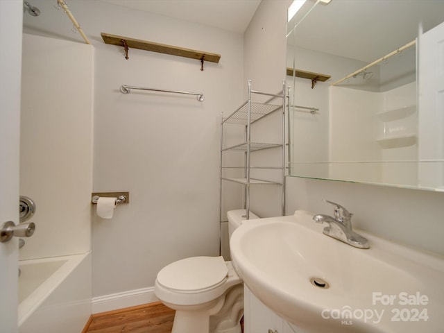 full bathroom featuring vanity, hardwood / wood-style flooring, toilet, and tub / shower combination