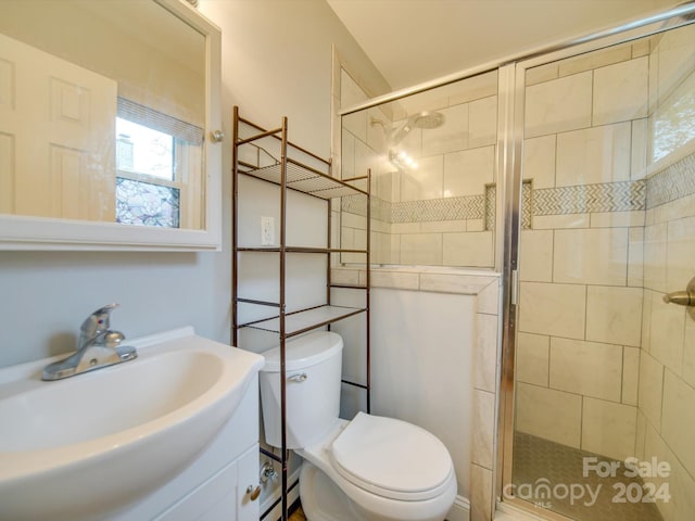 bathroom featuring vanity, baseboard heating, toilet, and a shower with door