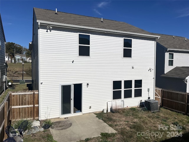 back of property with central air condition unit