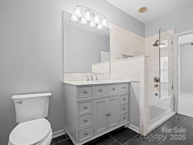 bathroom with tile patterned floors, toilet, a bathing tub, a shower, and vanity