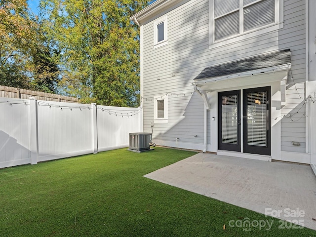 exterior space with a patio area, cooling unit, and fence