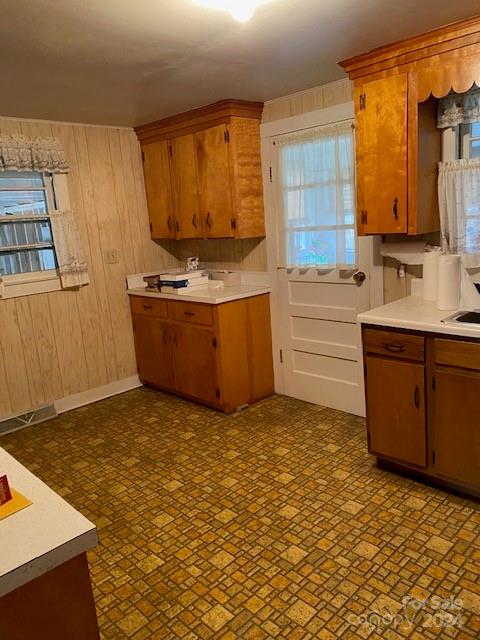 kitchen featuring wooden walls