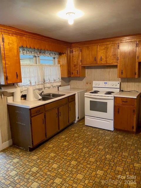 kitchen with backsplash, white electric range, and sink