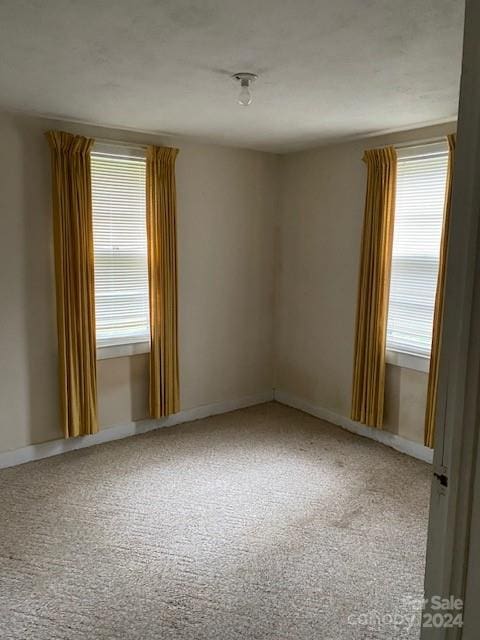 unfurnished room with carpet