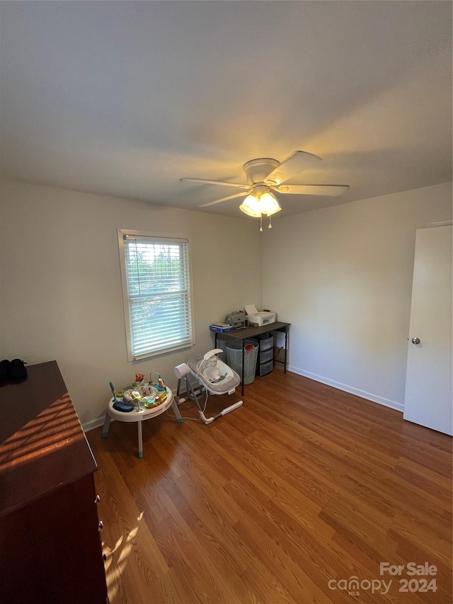 misc room featuring hardwood / wood-style floors and ceiling fan