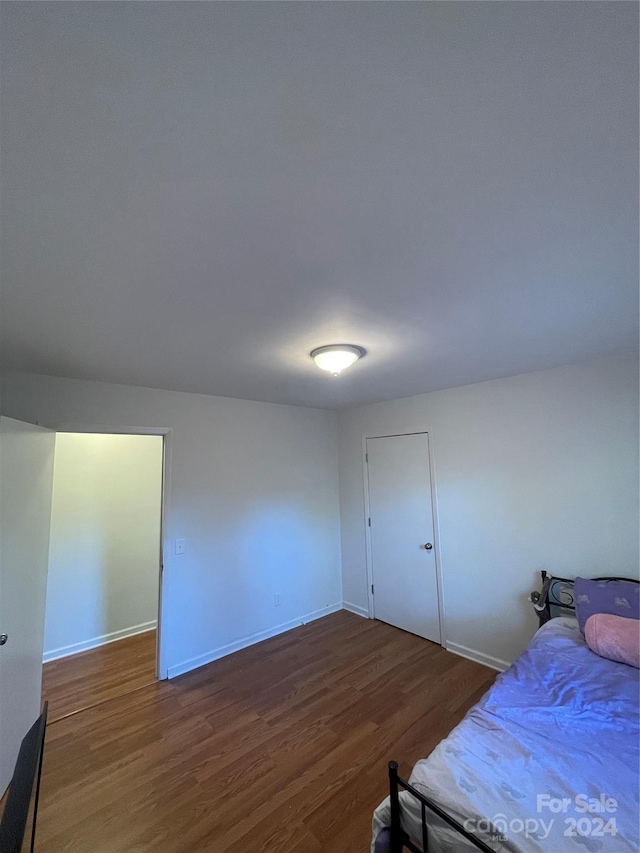 bedroom featuring dark hardwood / wood-style floors