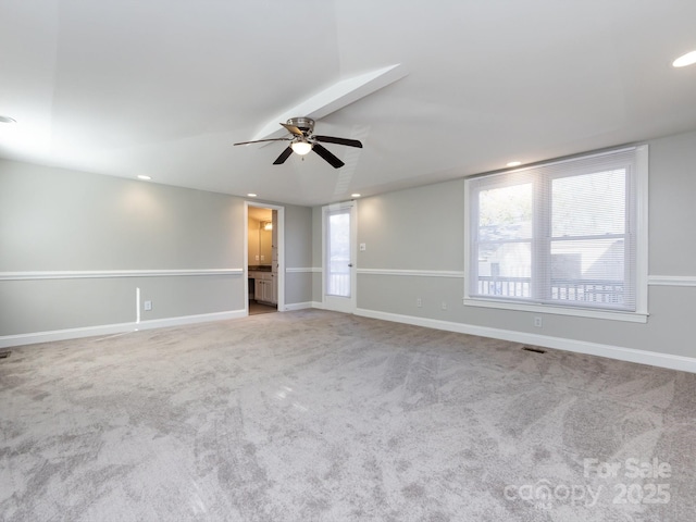 empty room with light carpet and ceiling fan