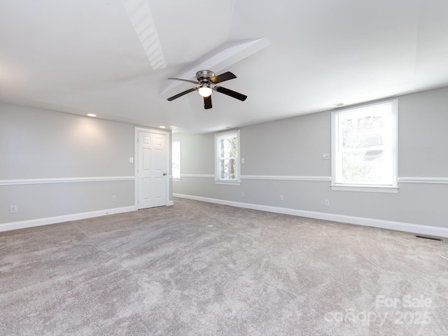 carpeted empty room featuring ceiling fan