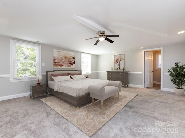 bedroom featuring beam ceiling, ceiling fan, and light carpet