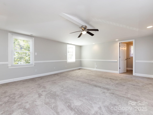 carpeted empty room with ceiling fan