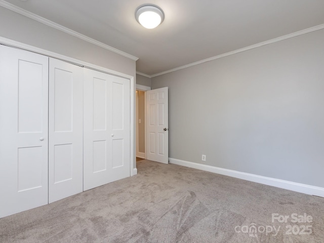 unfurnished bedroom featuring light carpet, a closet, and ornamental molding