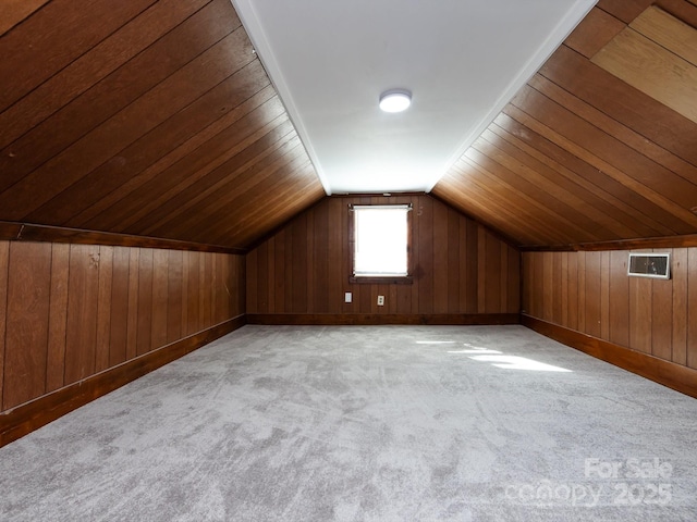 bonus room with wooden walls, light colored carpet, wood ceiling, and lofted ceiling