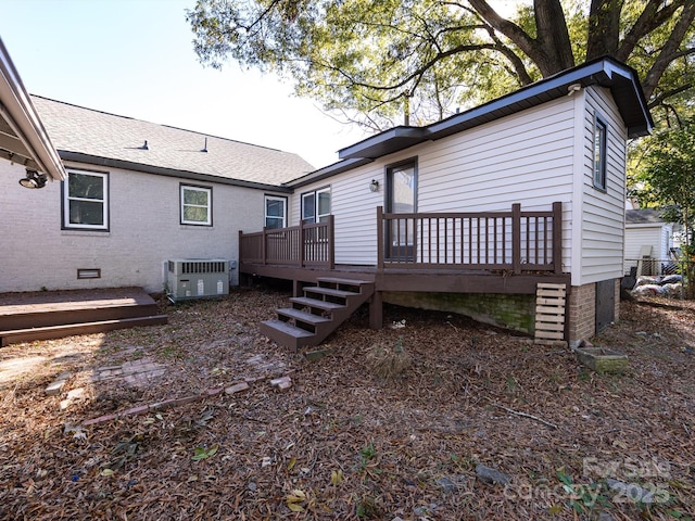 back of house with a wooden deck and central AC