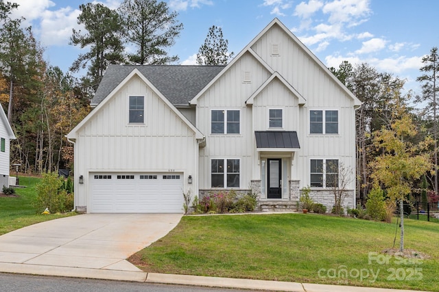 modern inspired farmhouse with a front yard and a garage