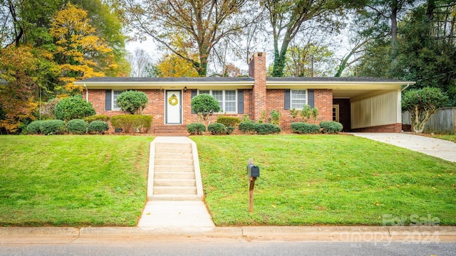 ranch-style home with a front lawn and a carport