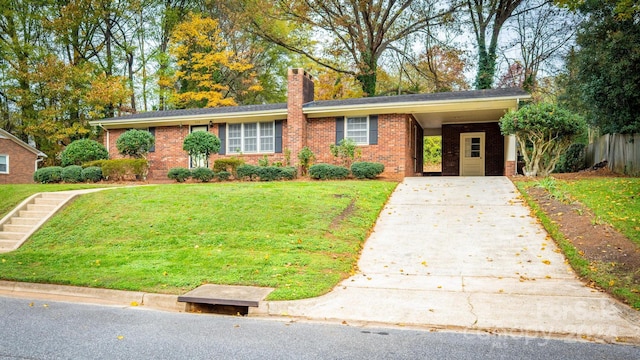 view of front facade with a front lawn and a carport