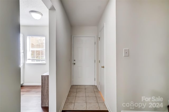 hallway with light tile patterned floors