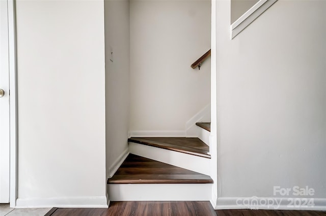 stairs with hardwood / wood-style floors