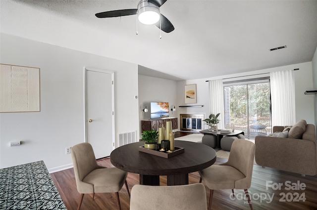 dining room with dark hardwood / wood-style floors and ceiling fan