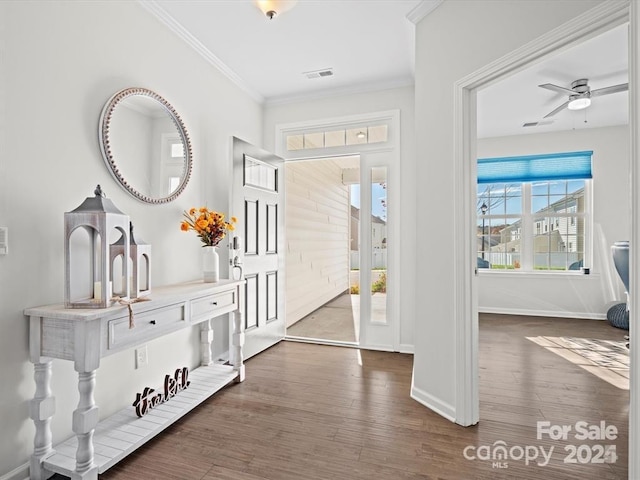 entryway featuring ornamental molding, dark hardwood / wood-style floors, and ceiling fan