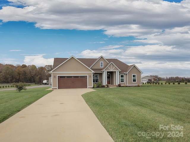 craftsman-style house with a front yard and a garage