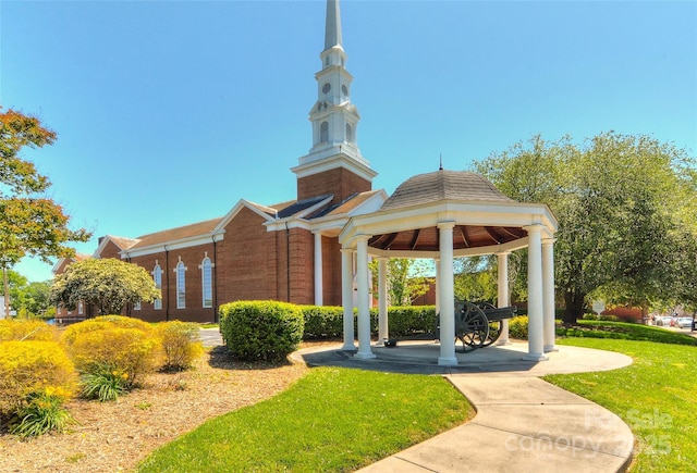 view of property's community featuring a gazebo and a yard