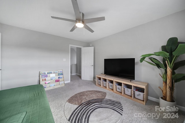 living room with ceiling fan and carpet