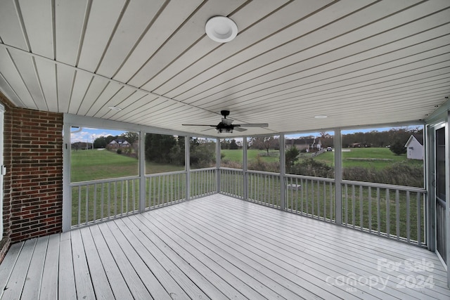 wooden deck featuring ceiling fan