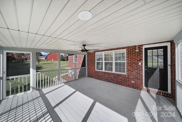 wooden terrace featuring ceiling fan