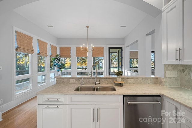 kitchen with white cabinetry, sink, and light hardwood / wood-style floors