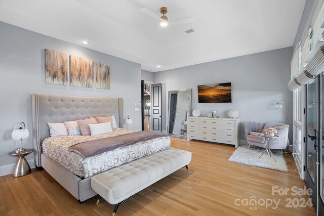 bedroom featuring hardwood / wood-style flooring and ceiling fan